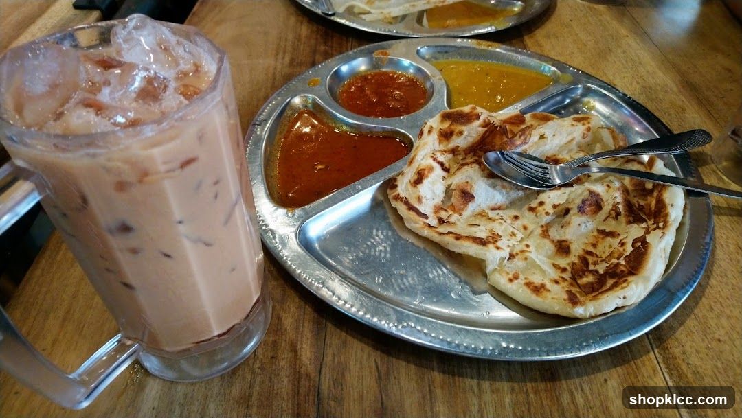 Roti Canai with Curry and Iced Tea