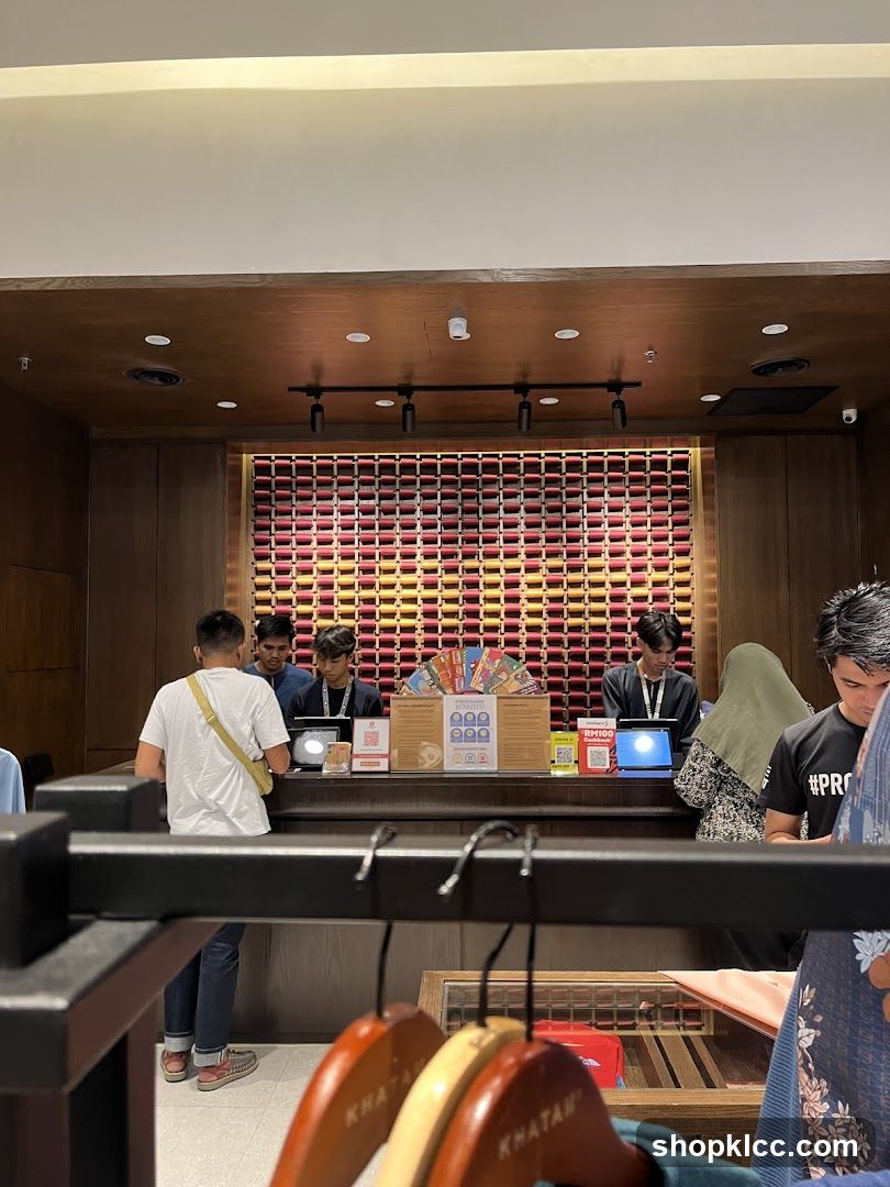 Retail counter with staff and customers