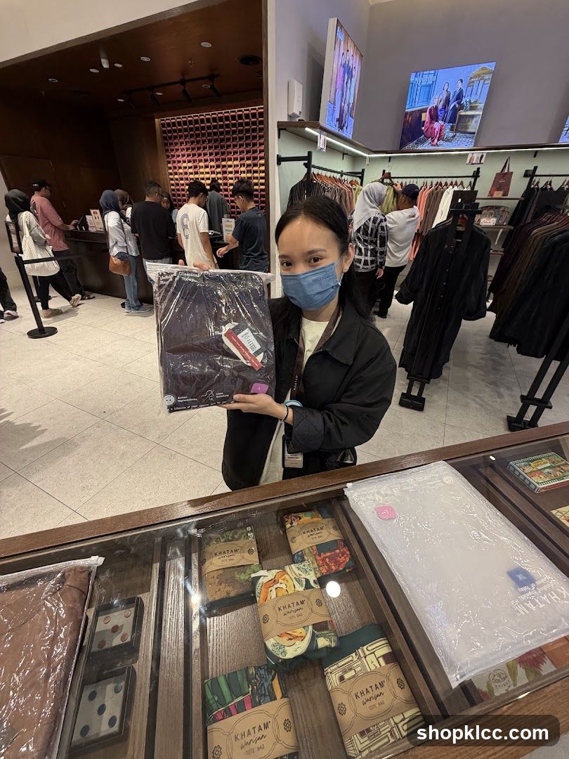 Woman holding a packaged garment in a store