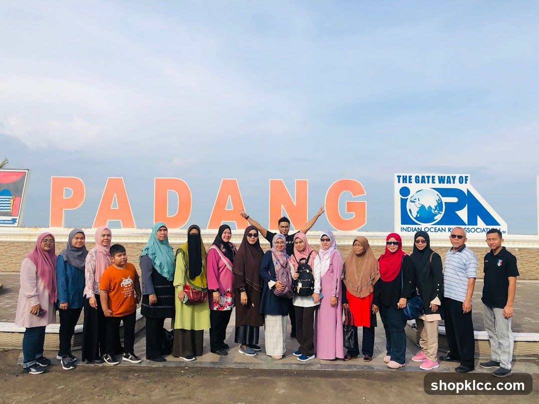 Group Poses in Front of Large Signage