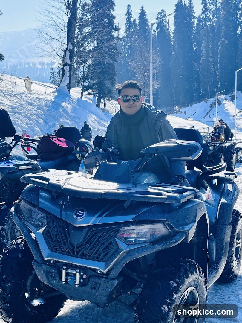 Man on ATV in Snowy Landscape
