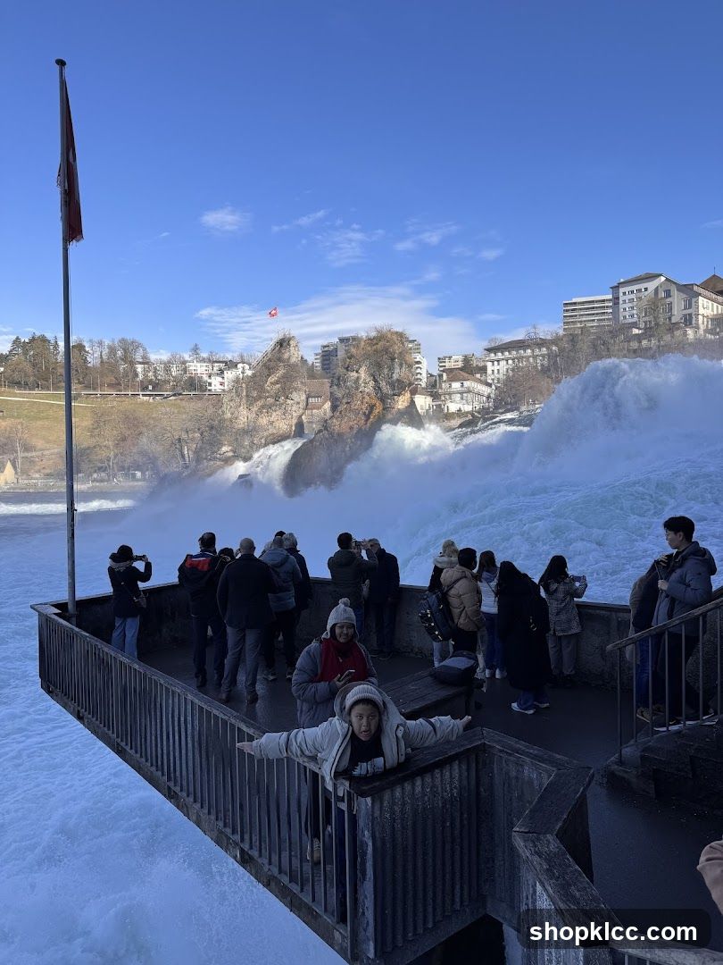 Tourists at a Waterfall Viewing Platform