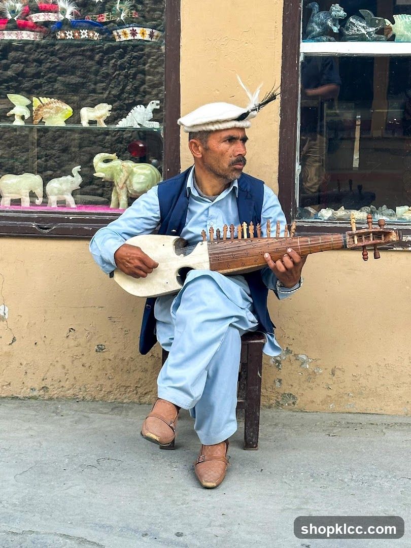 Musician playing a traditional instrument outside a shop
