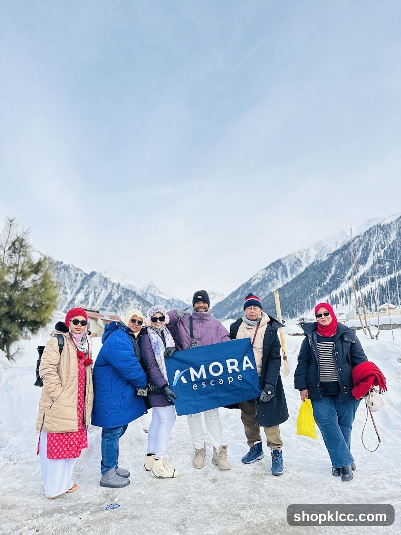 Group holding a banner in the snow
