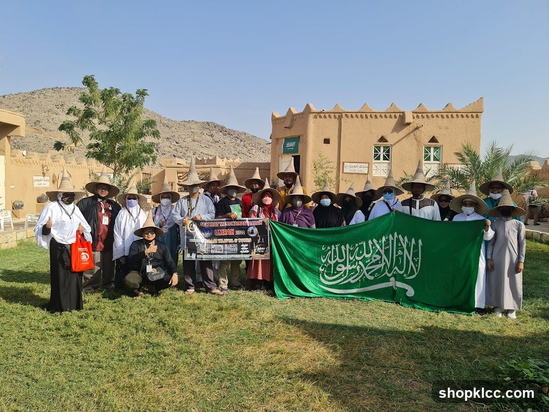 Group Poses with Saudi Flag