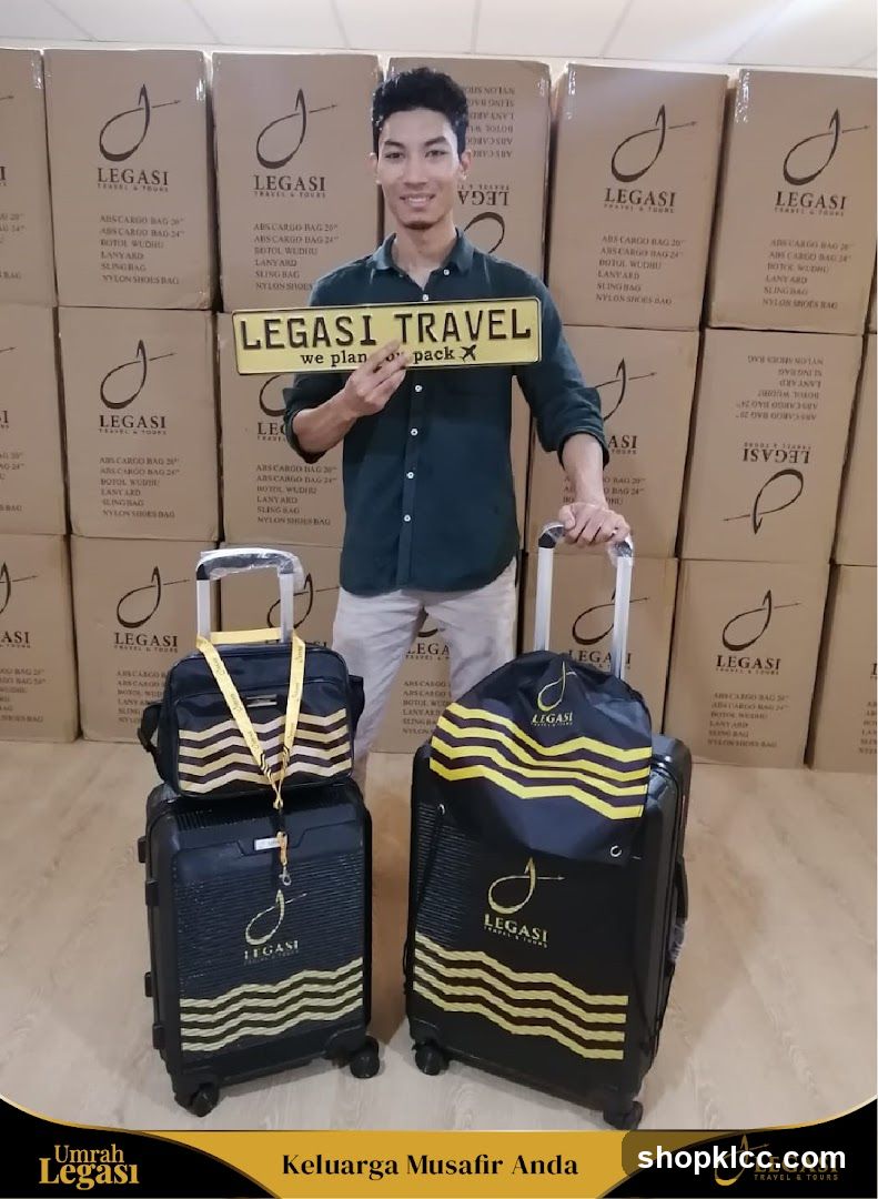 Man holding a sign with luggage