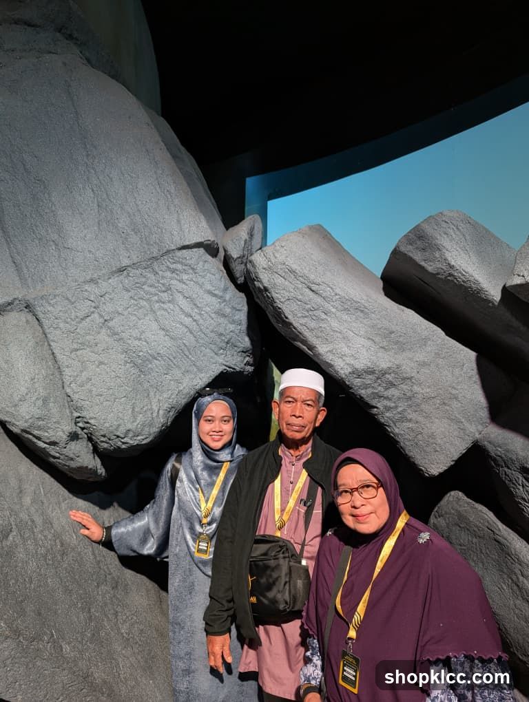 Family Posing in Front of Rock Formation