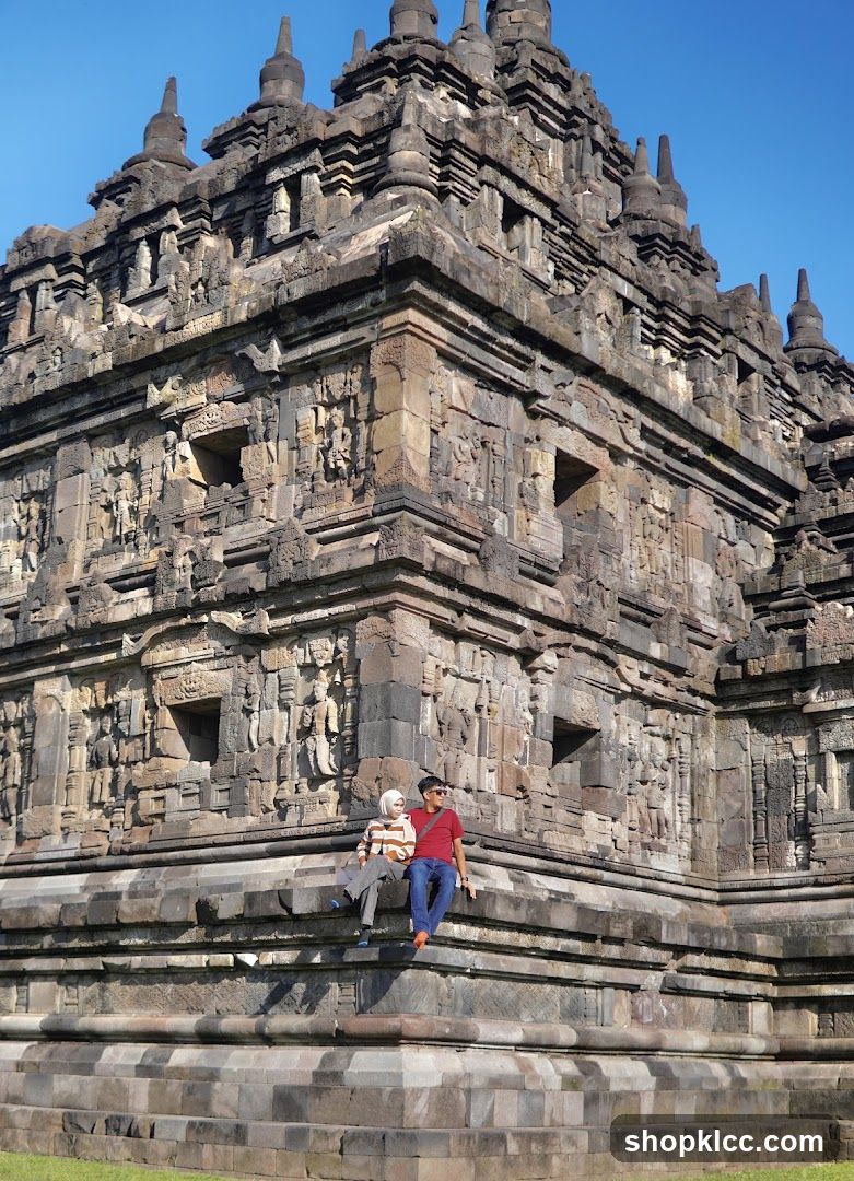 Couple sitting on ancient temple steps