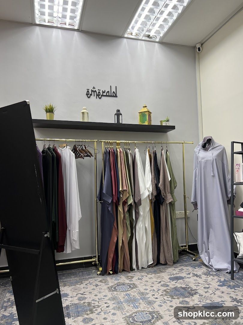 Clothing store interior with abayas on display