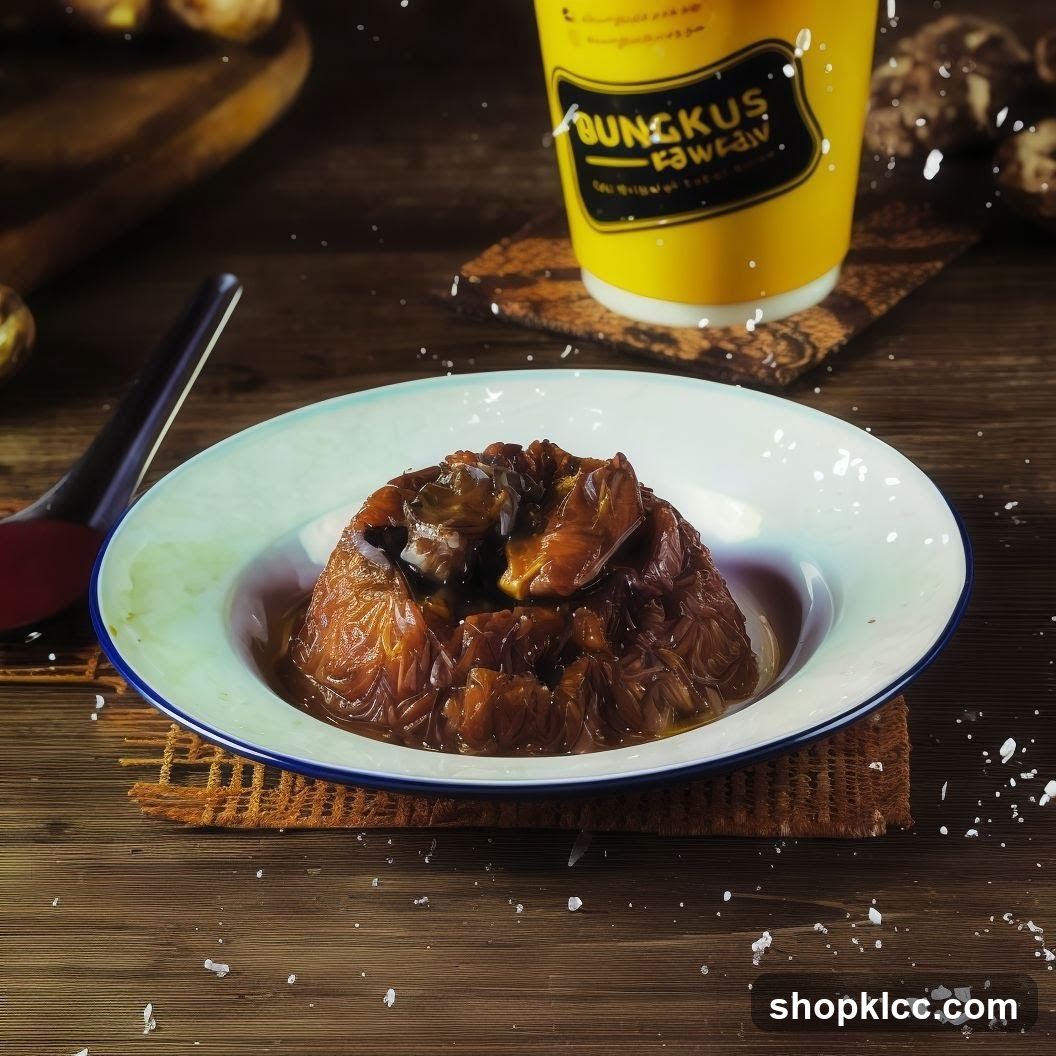 A close-up shot of a braised dish served in a white bowl with a blue rim, placed on a woven coaster. The dish appears to be made of noodles or shredded ingredients, topped with pieces of meat in a rich sauce. In the background, a yellow cup with the logo "BUNGKUS FAWEAW" is visible, also on a coaster. The setting is a wooden table, with scattered white specks resembling salt or sugar. A spoon with a red handle is on the left side of the frame.