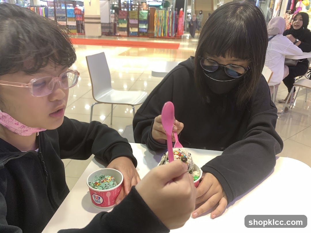 Two girls eating ice cream