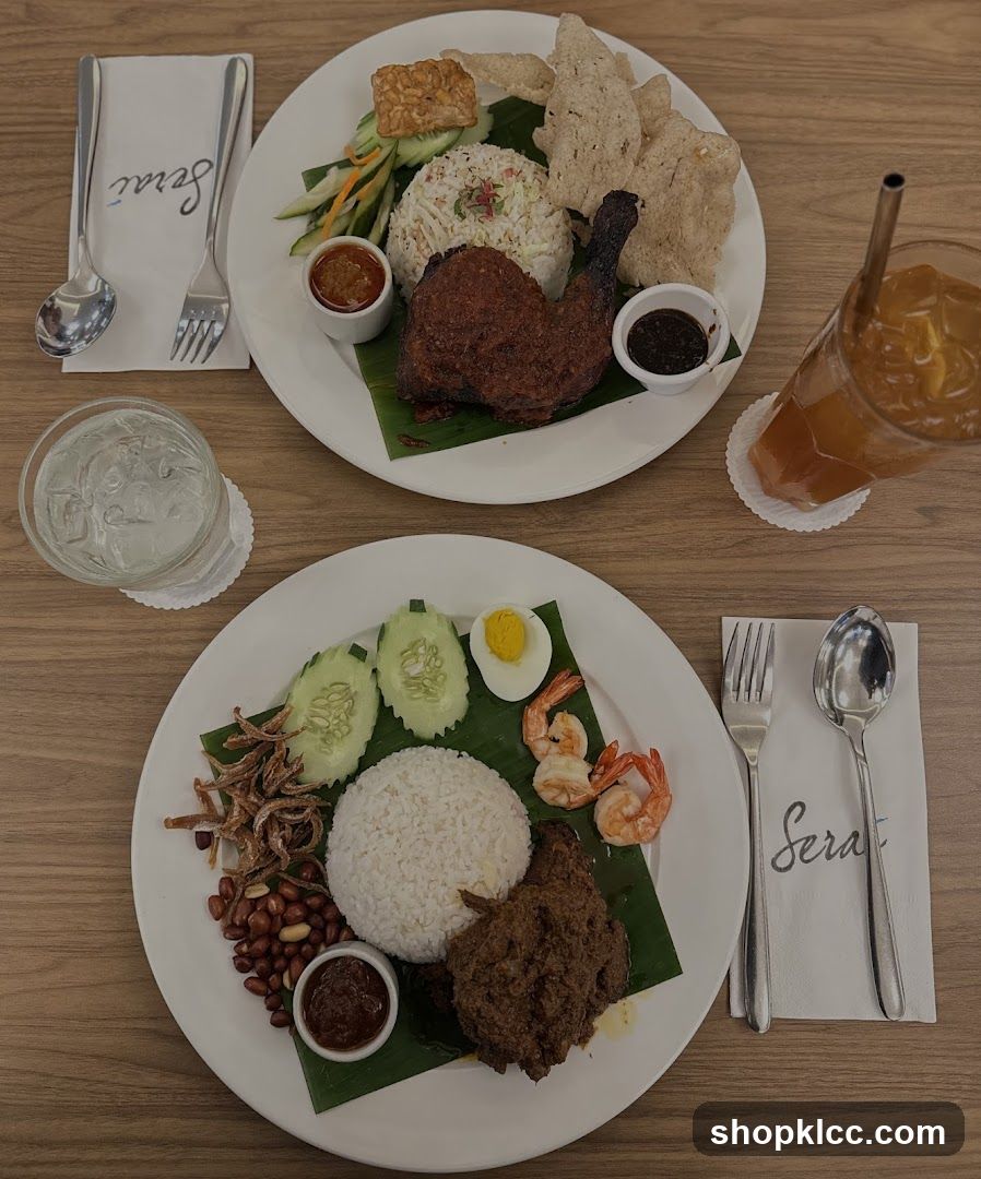 Two plates of Malaysian cuisine with drinks