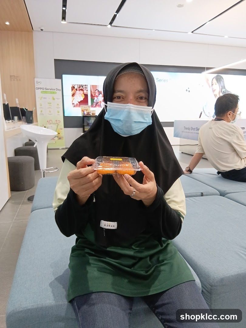 Woman holding a container of food