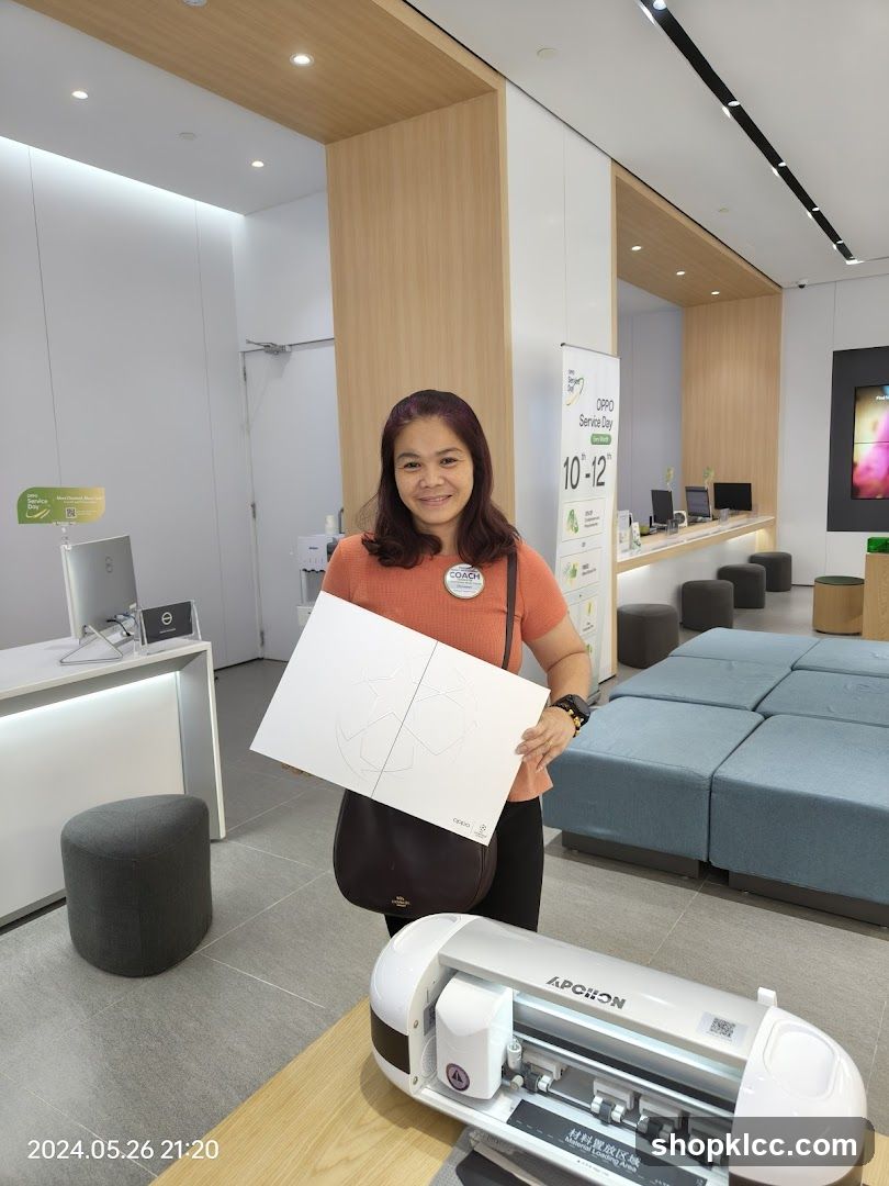 Woman holding a paper cutout in an electronics store