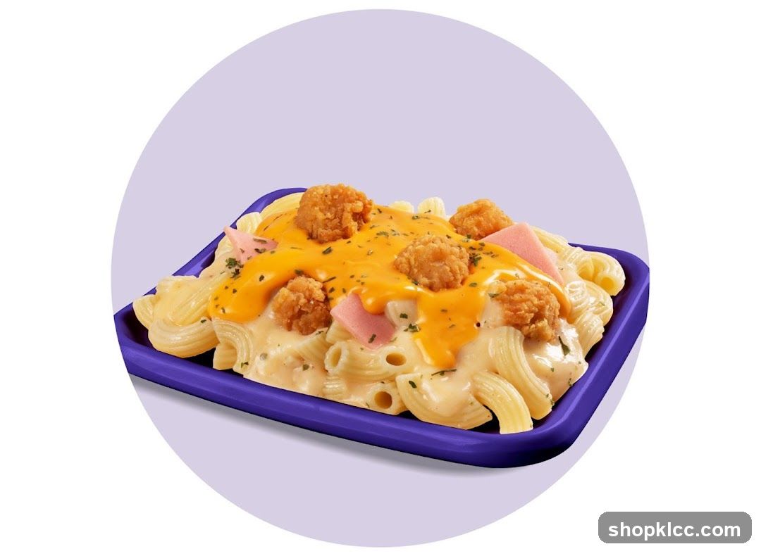 Macaroni with cheese sauce and fried chicken bites