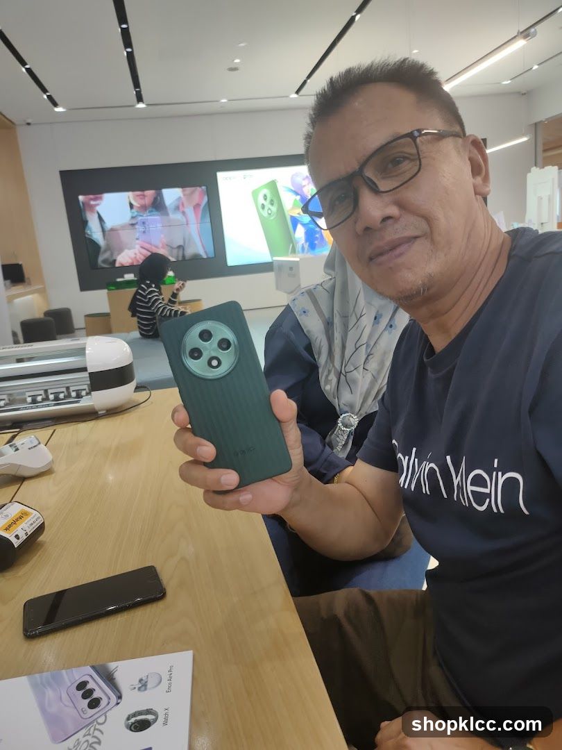 Man holding a phone case in a store