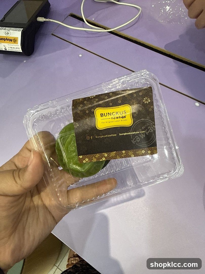 Green dessert in plastic container