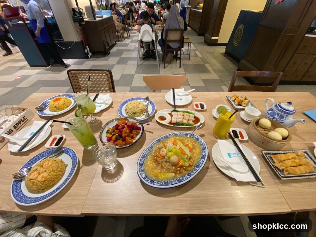 Table laden with Chinese food and drinks