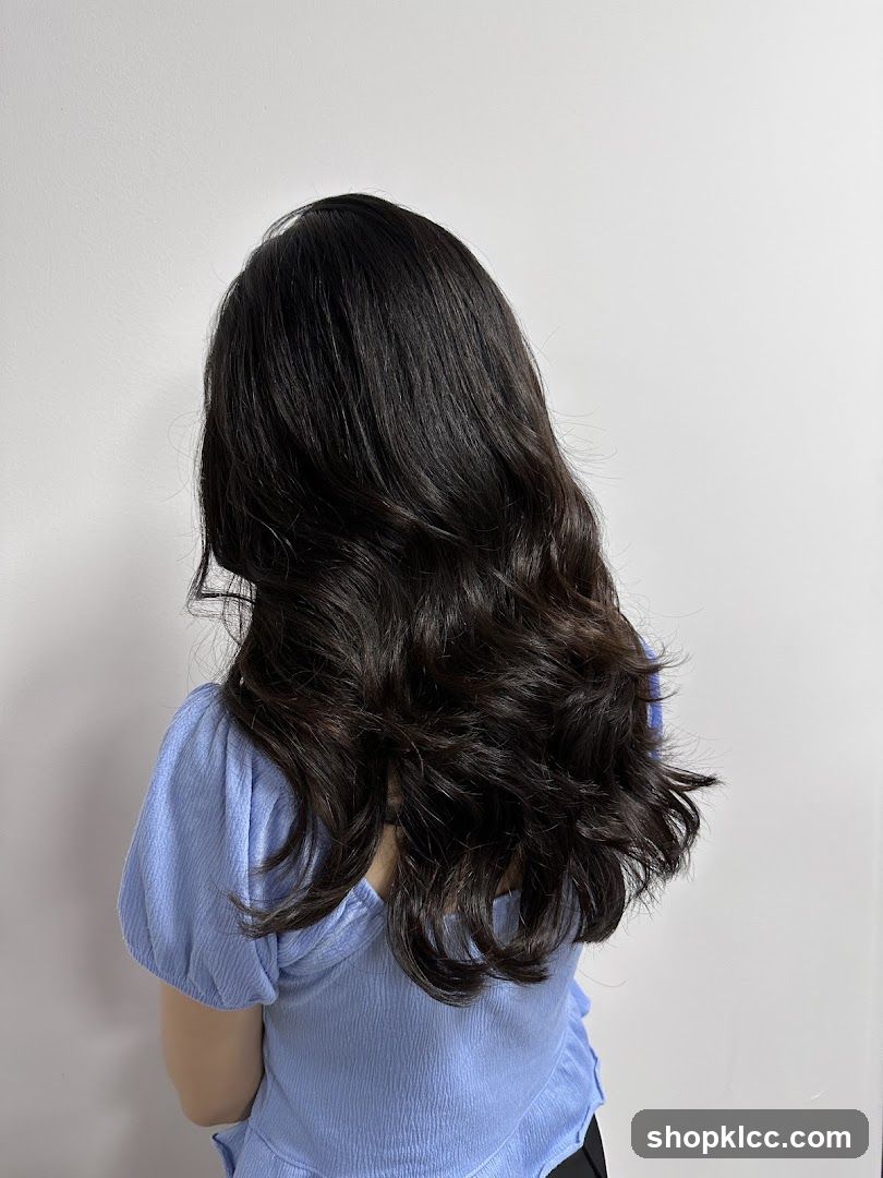 Woman with long, dark, wavy hair