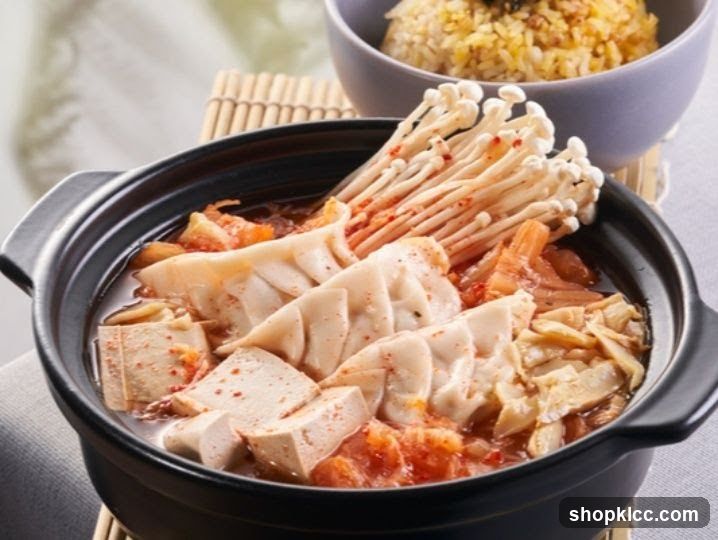 Kimchi Stew with Dumplings and Enoki Mushrooms