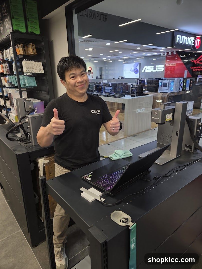 Man giving thumbs up in computer store