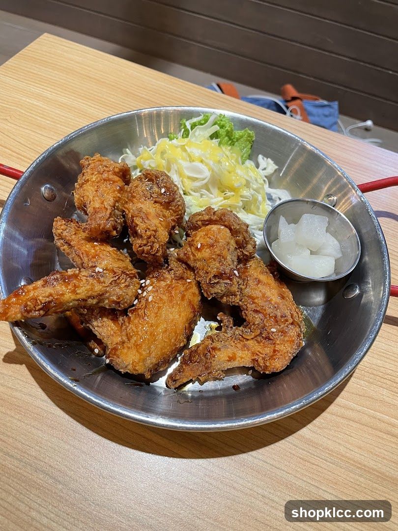 Fried Chicken Wings with Salad and Pickled Radish