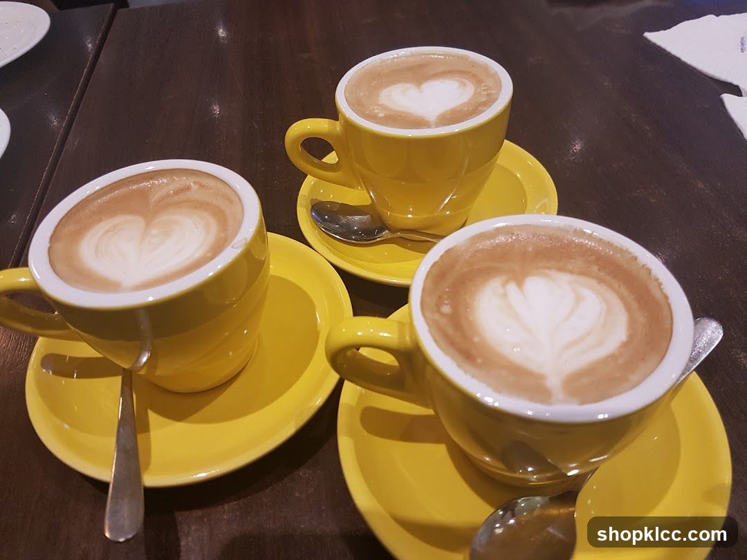 Three cups of coffee with latte art