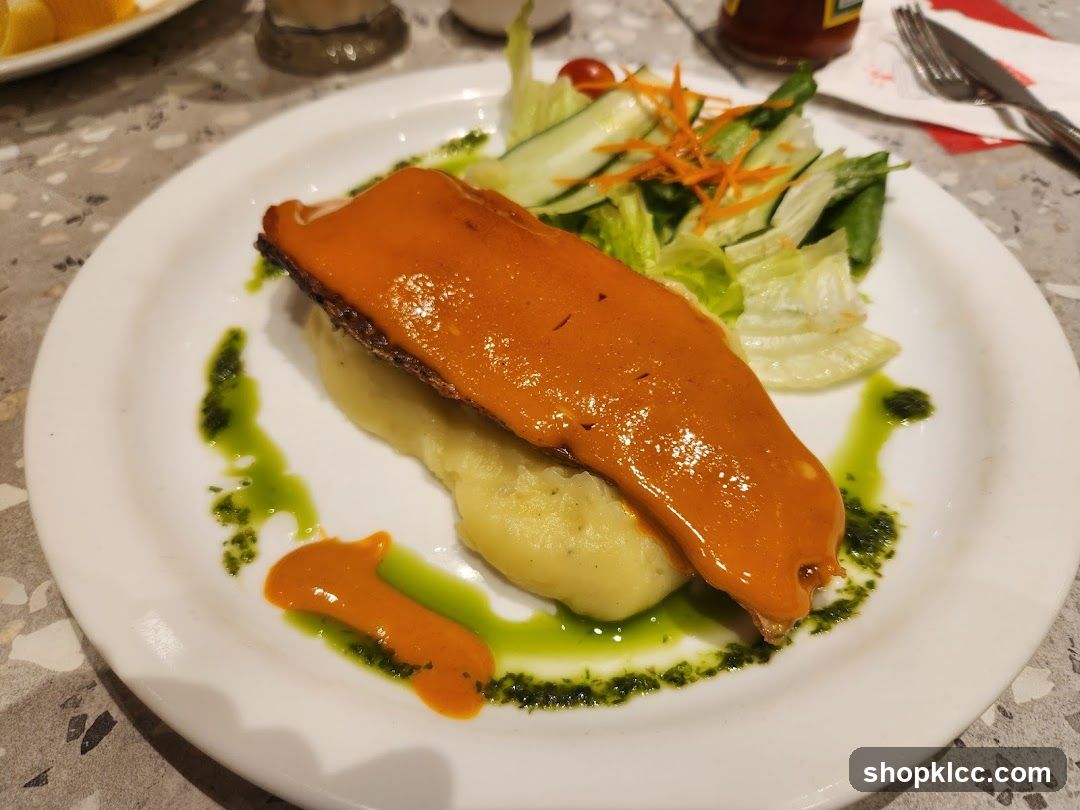 Fish dish with mashed potatoes and salad