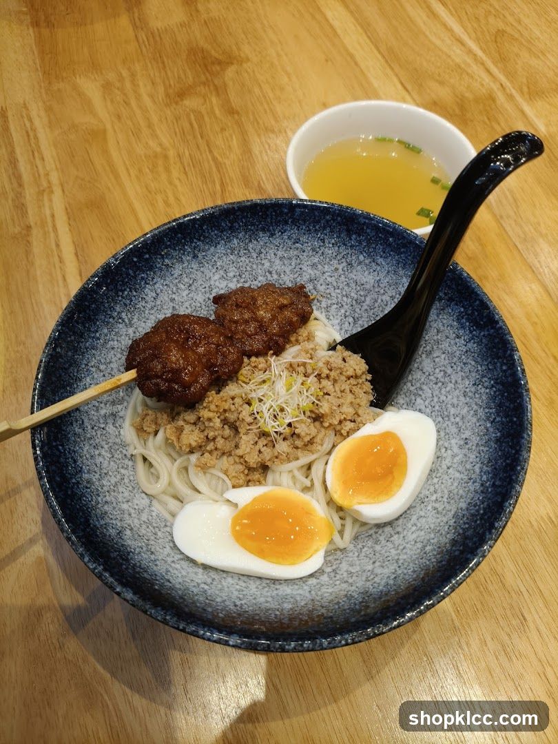Noodle Dish with Egg and Meat Skewers