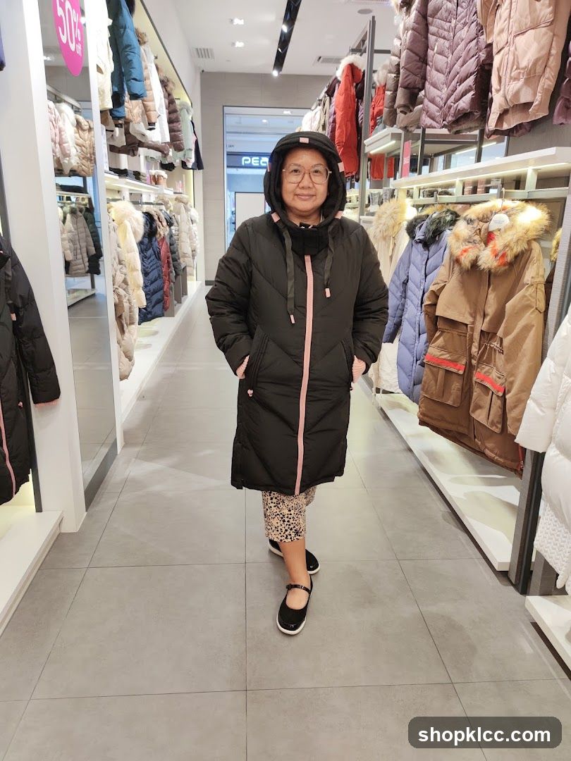 Woman in a Puffer Coat in a Clothing Store