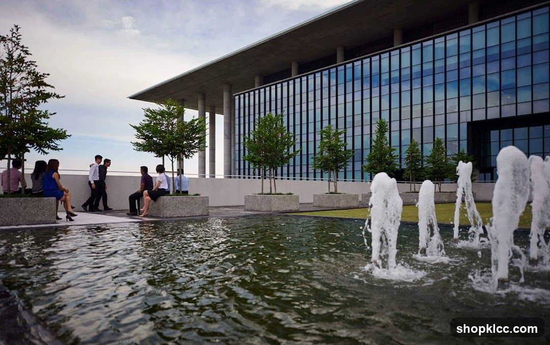 Modern Office Building with Outdoor Seating and Fountain