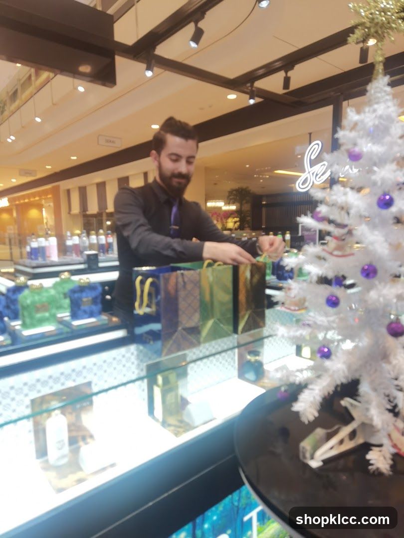 Sales associate wrapping gifts