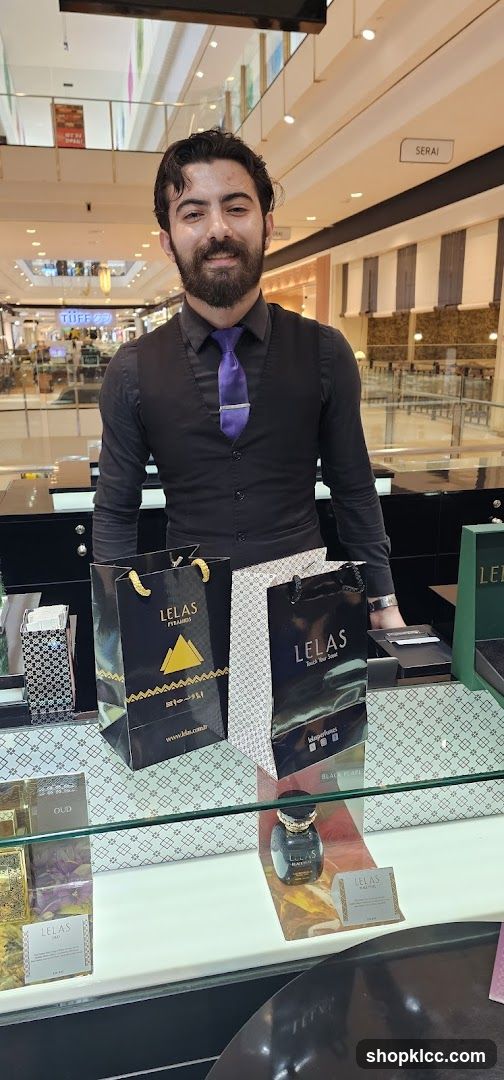 Salesperson with Perfume Bags