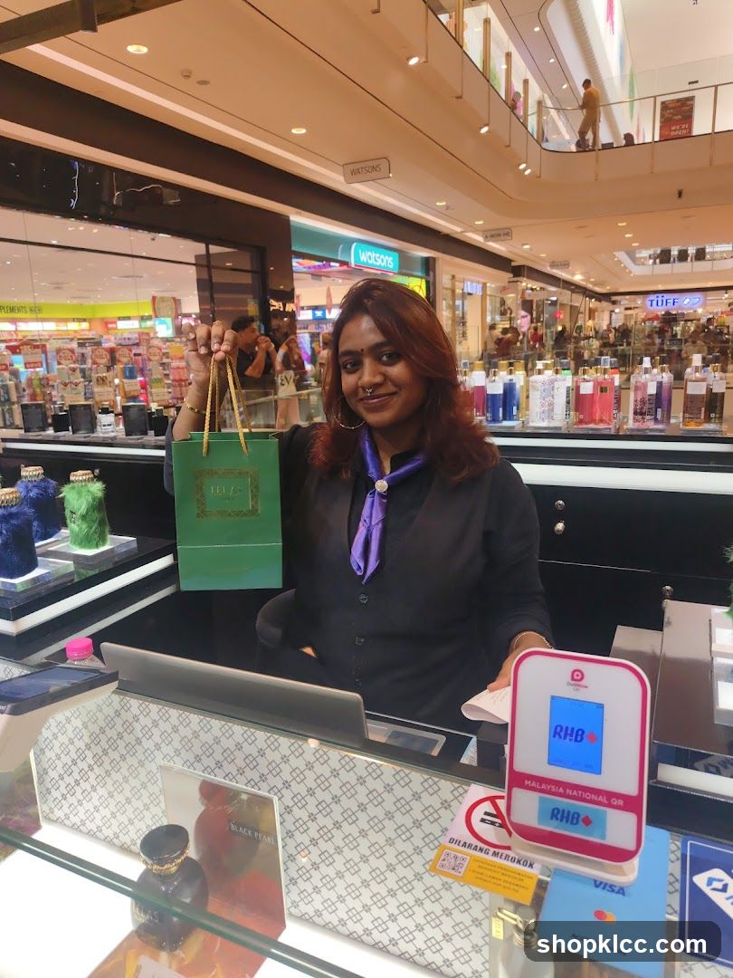 Sales associate holding a shopping bag