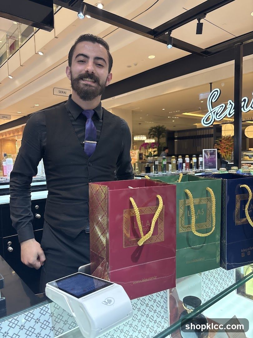 Sales associate with shopping bags