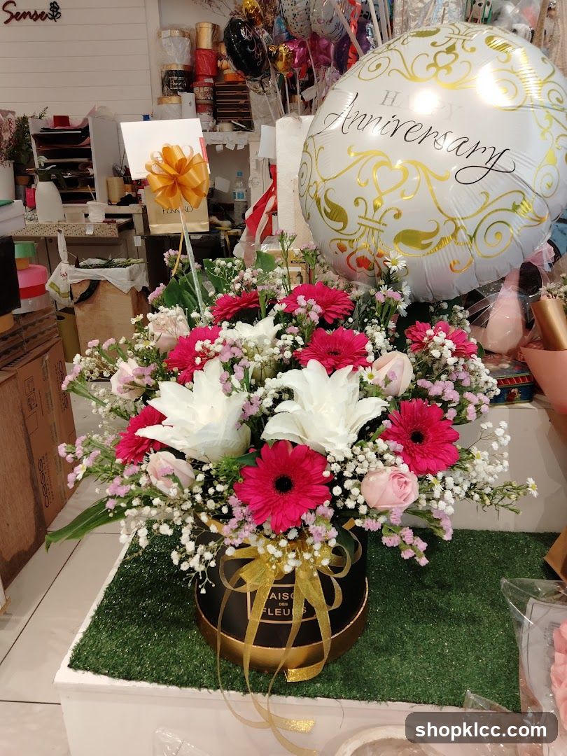 Flower arrangement with anniversary balloon