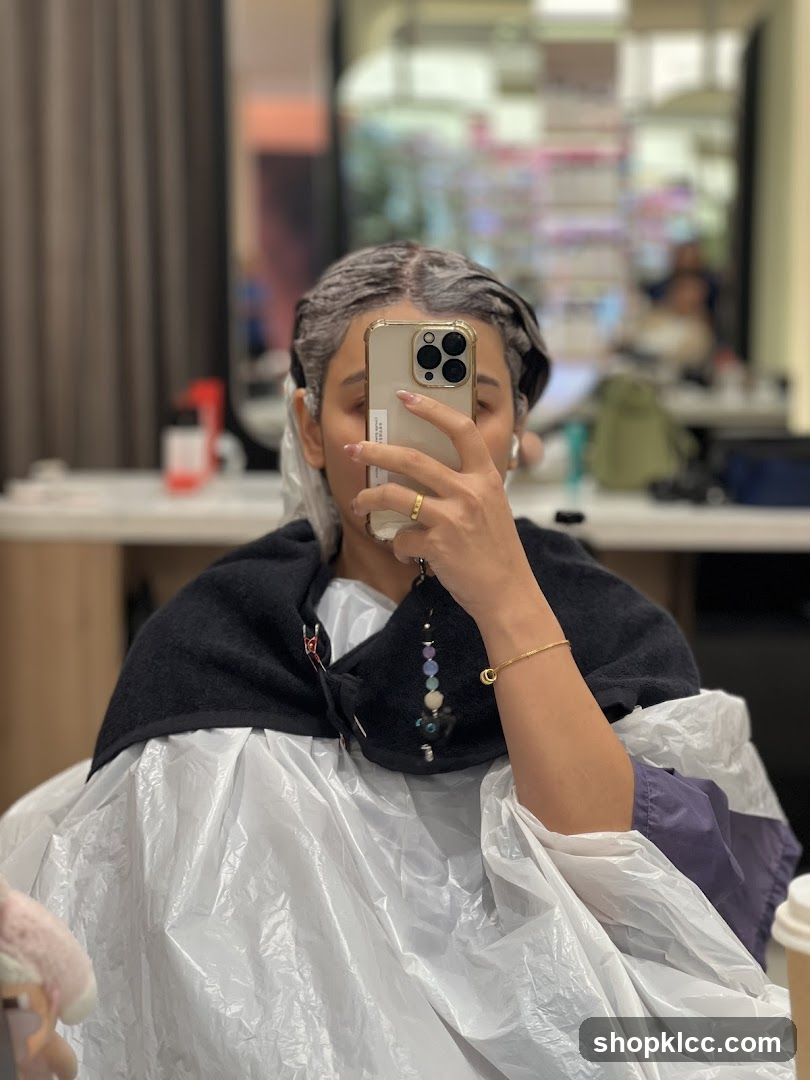 Woman getting hair dyed