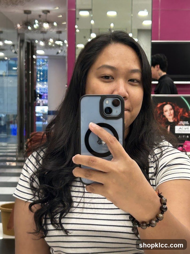 Woman taking a selfie in a salon
