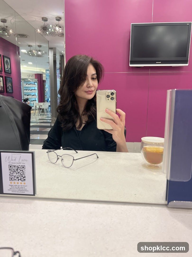 Woman taking a selfie in a salon