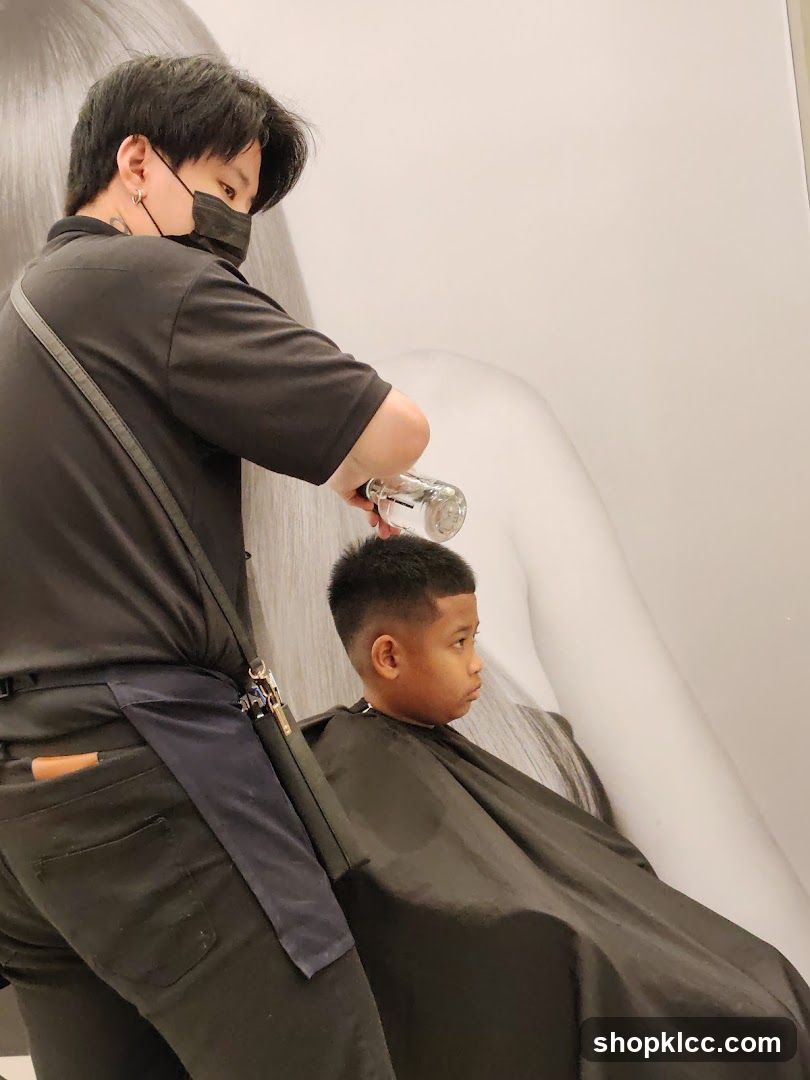 Barber giving a haircut to a child