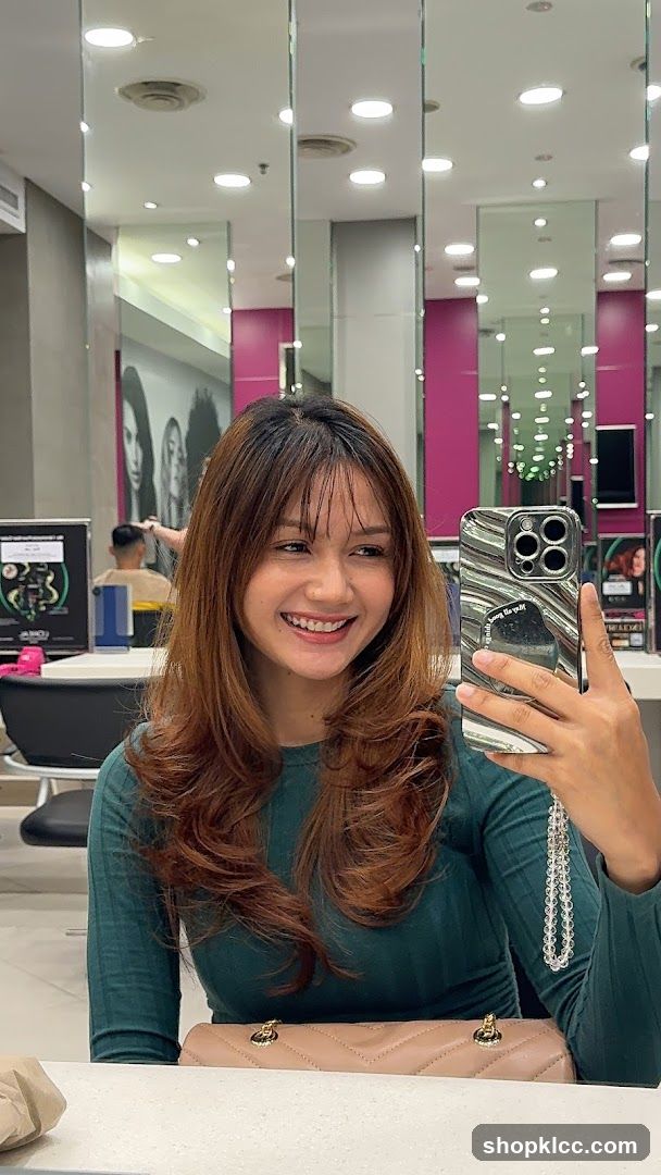 Woman taking a selfie in a salon