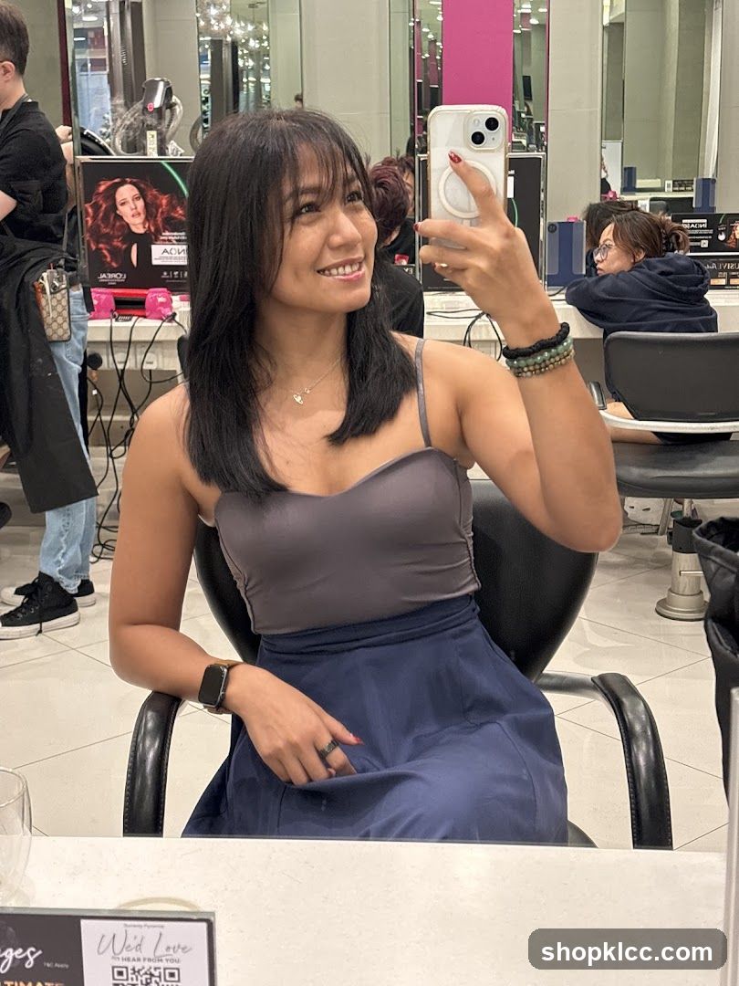 Woman taking a selfie in a salon