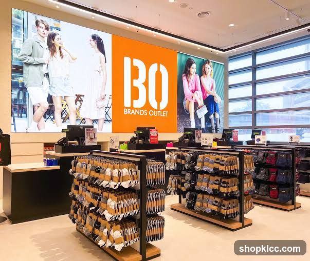 Clothing store interior with large digital display