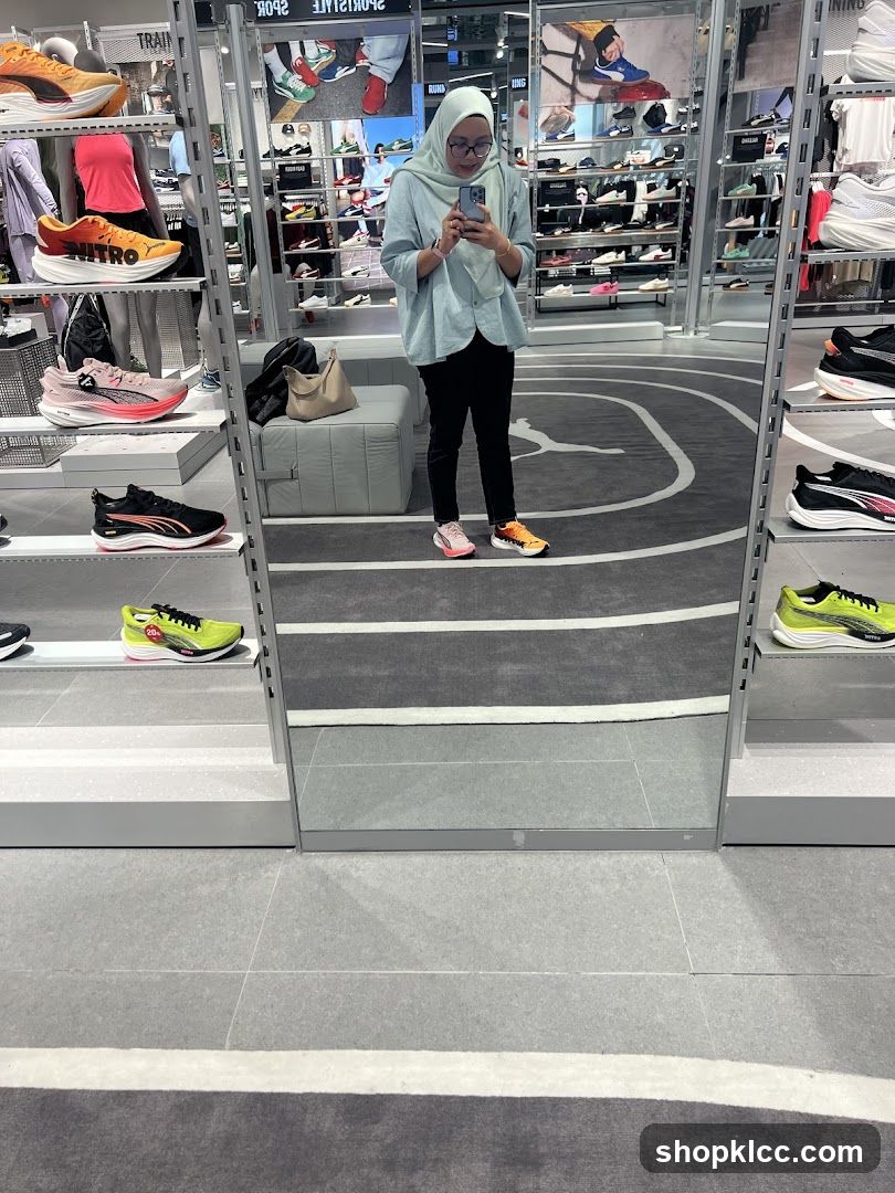 Woman taking a mirror selfie in a shoe store
