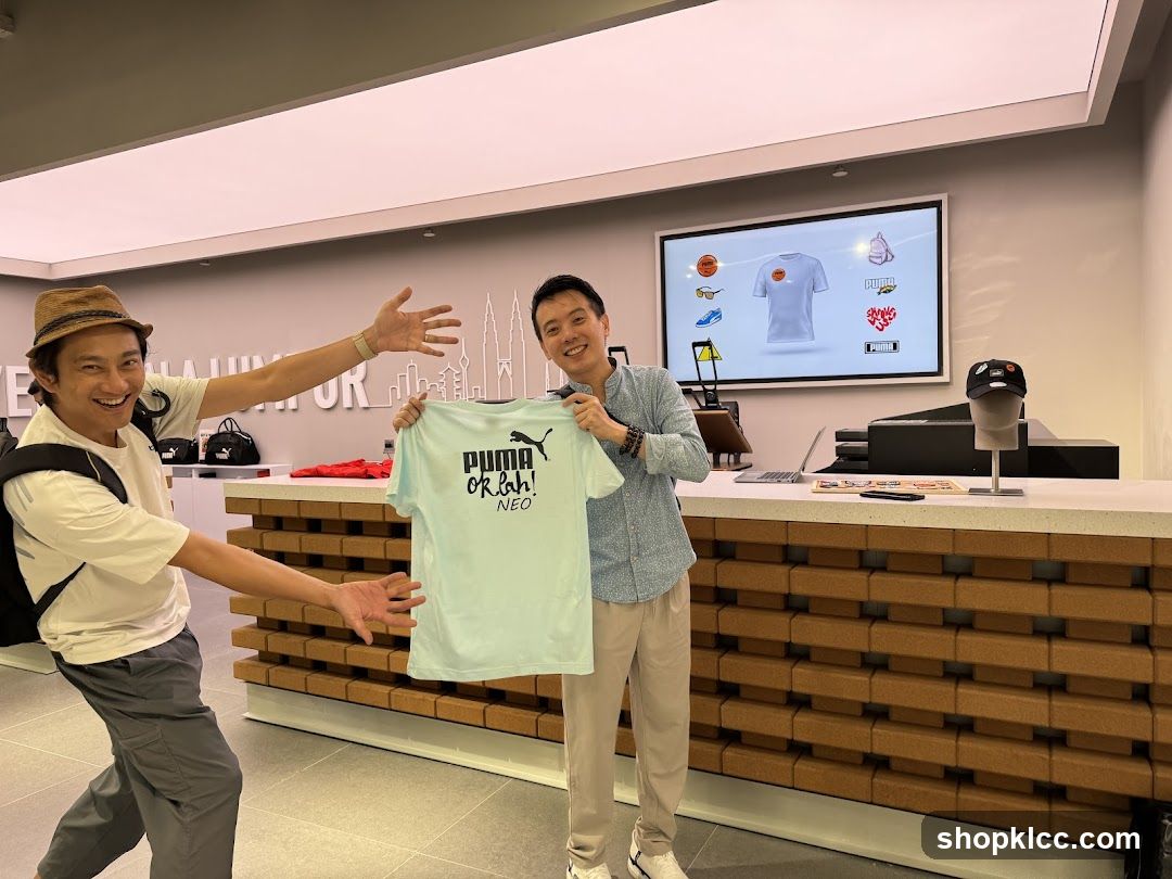 Two men in a store holding a t-shirt