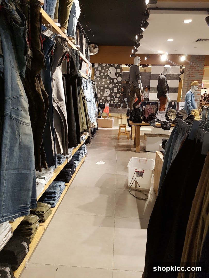 Clothing store interior with mannequins and apparel