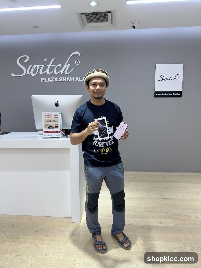 Man holding a new phone in a store