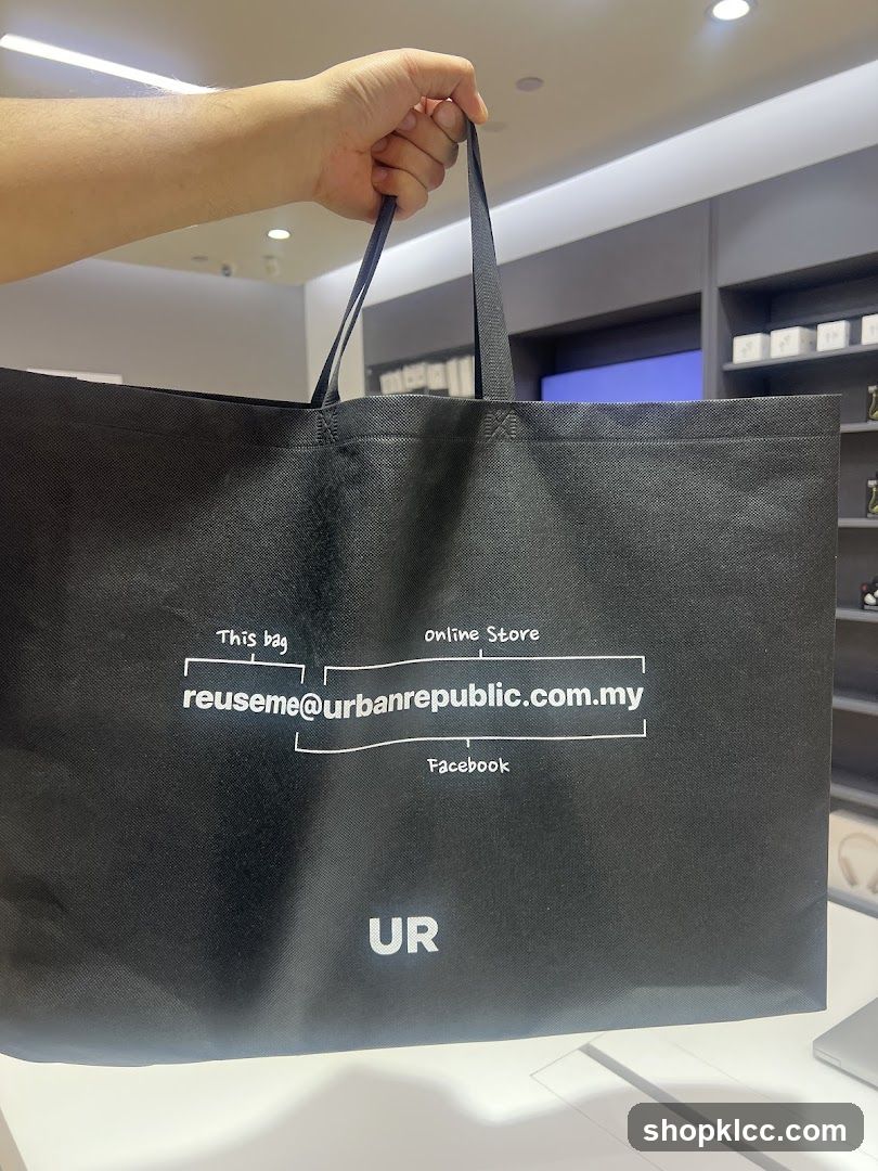 Black reusable bag with brand information
