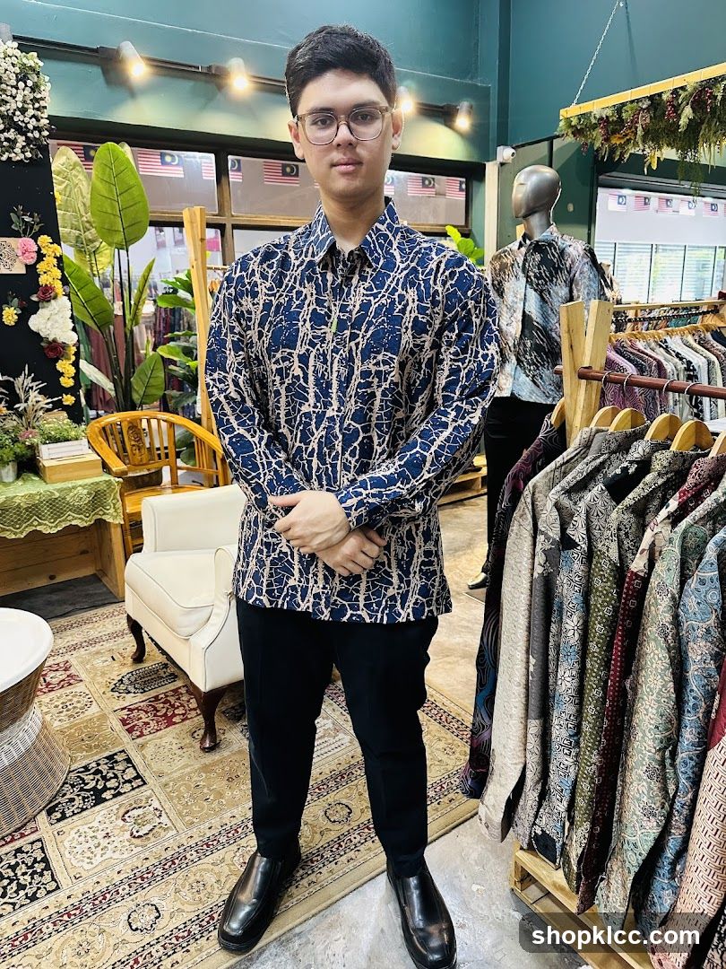 Man in Batik Shirt in Store