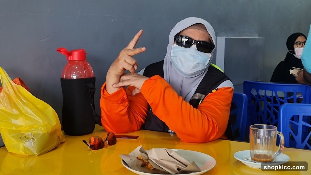 Person posing at a table